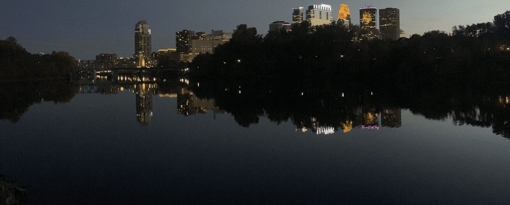 Nighttime cityscape with illuminated buildings
