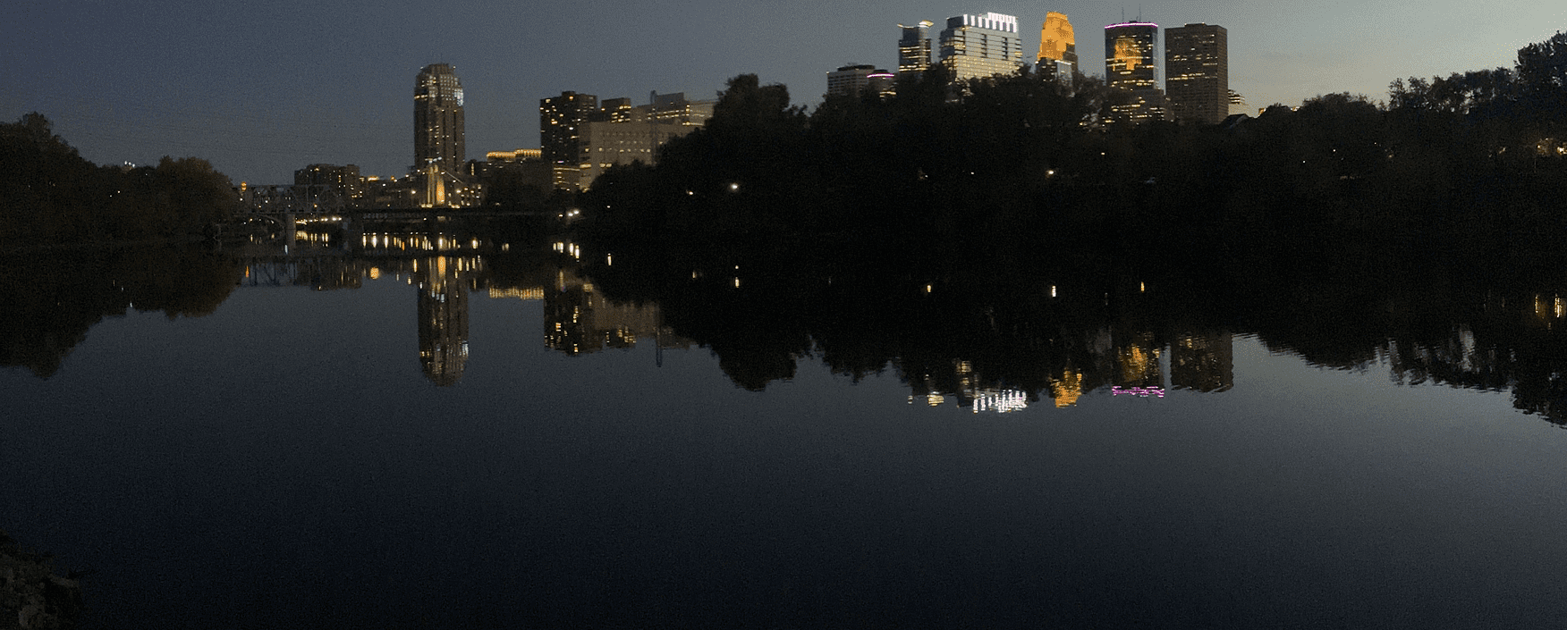 Nighttime cityscape with illuminated buildings